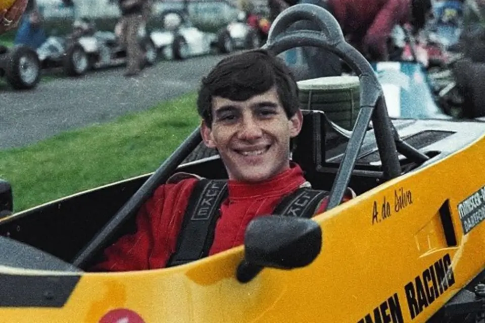 Ayrton Senna stands in uniform ready for another race - Silverstone, 1992
